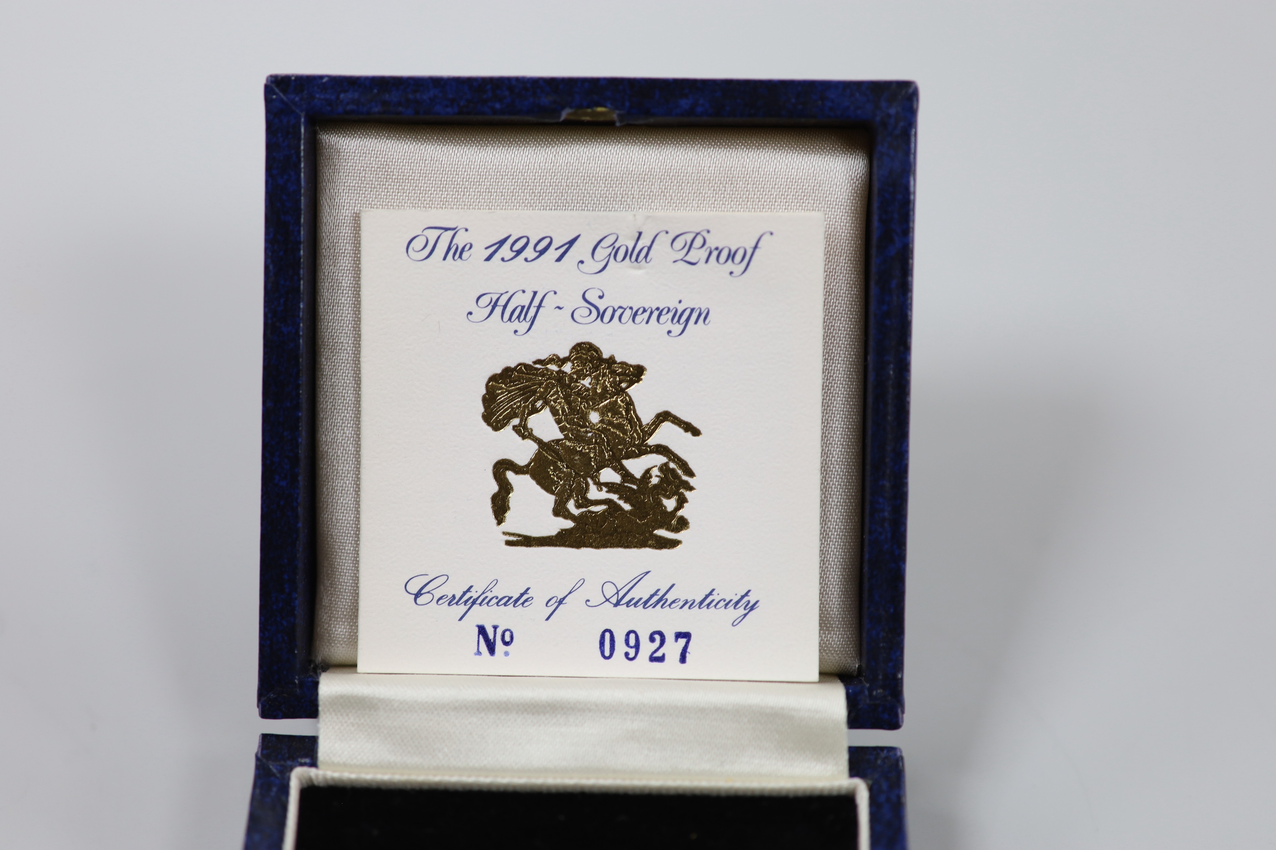 An Elizabeth II 1991 gold proof half sovereign, with box and certificate.